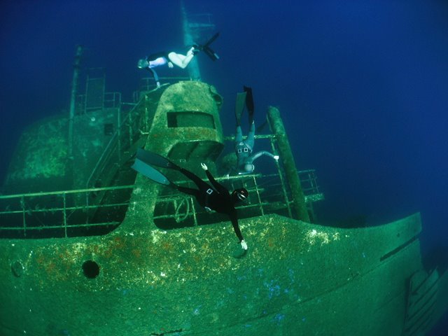 Emma Farrell and Anna von Boetticher freediving on a large wreck in Kalymnos, Greece